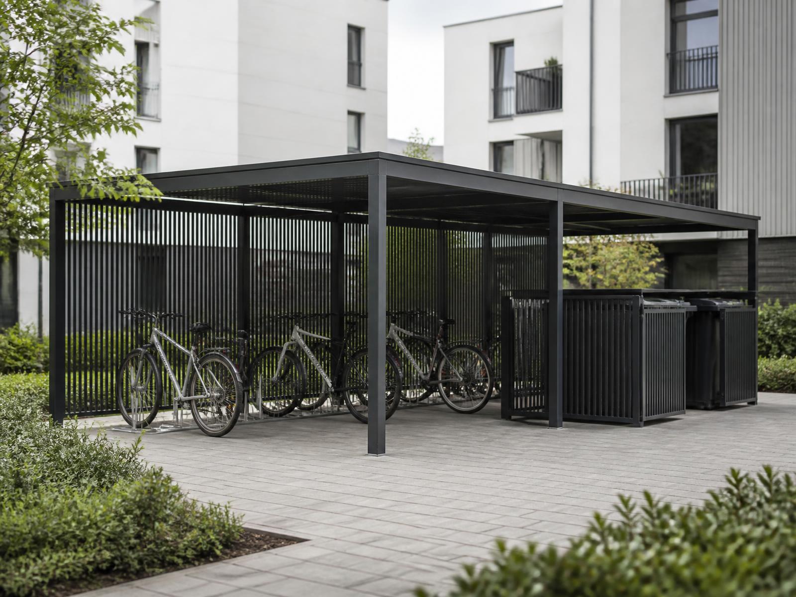 Fahrradhaus und Müllhaus aus dunklem Metall in einem Innenhof